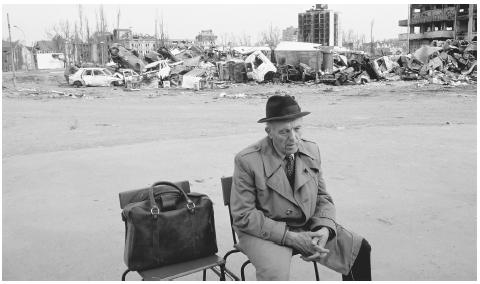 A man sits among the ruins of Vukovar, destroyed by fighting in 1991. The four-year struggle between Croats and Serbs destroyed many cities.