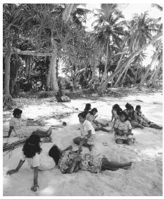 People relaxing on a beach in Majuro, Ratak. The average temperature on the Marshall Islands is 81 degrees.