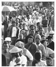 Voters wait in line in the first all-race elections, 1994. All South Africans have had the right to vote since this landmark year.