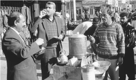 Iraqi men socialize at a tea stall in Baghdad.