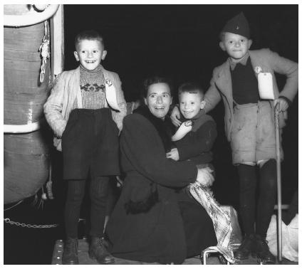 This 1948 photograph was taken shortly after this Polish woman and her three children arrived in New York City; they settled in Rensselaer, Indiana.