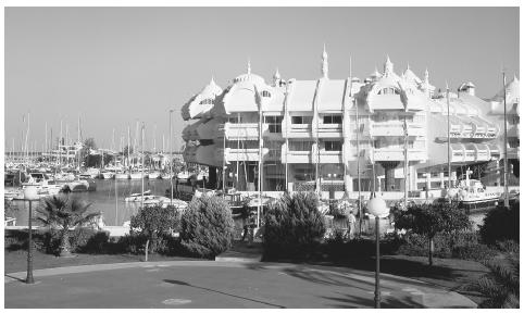 Apartments next to a marina in Malaga. Urban families often share bedrooms, and common rooms may be used for multiple purposes.